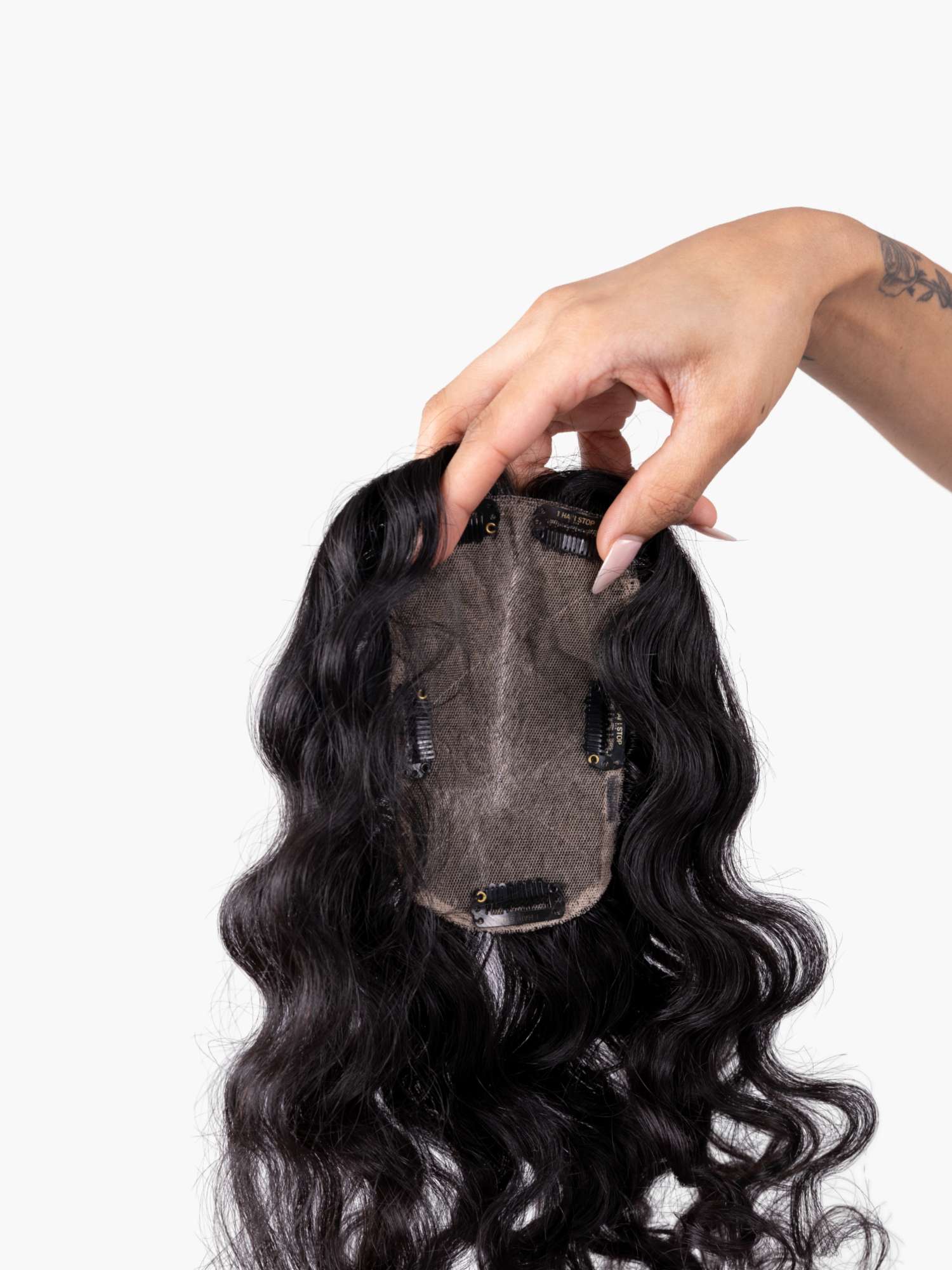 back view of large curly hair topper