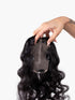 back view of large curly hair topper